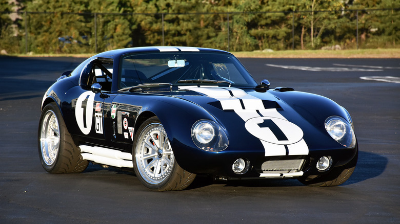 Factory Five Type 65 Coupe parked in a lot