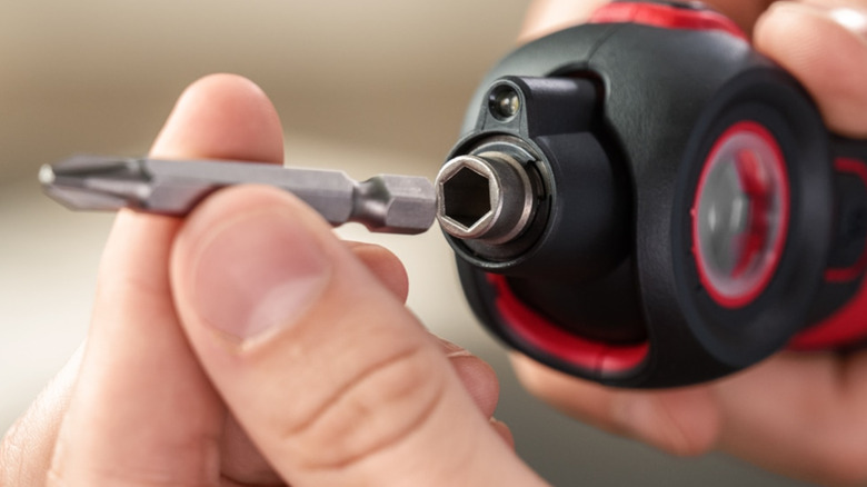 Putting bit in Skil 4V Cordless Screwdriver.