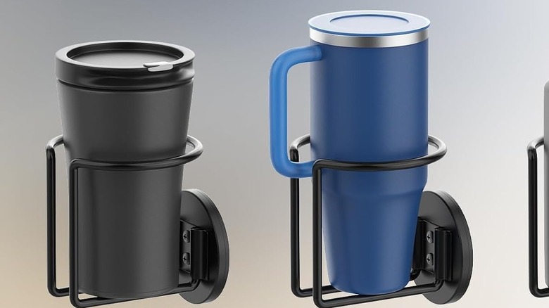 A pair of Durmmur cup holders with a pair of different mugs inside them.
