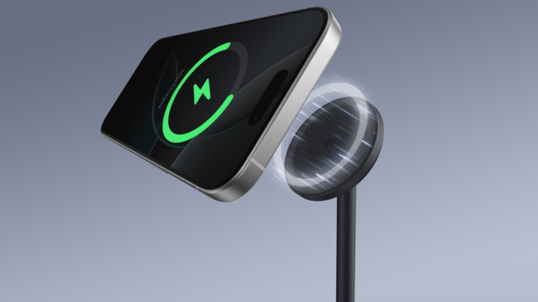 Anker Charger with phone next to it on gray background.