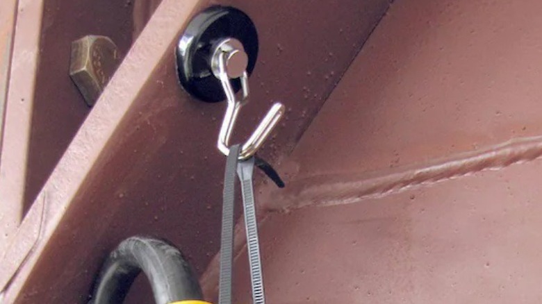 Tool hanging from magnetic hook