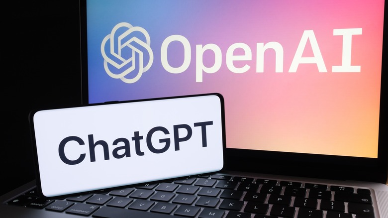 OpenAI and Chat GPT on smartphone screen and monitor