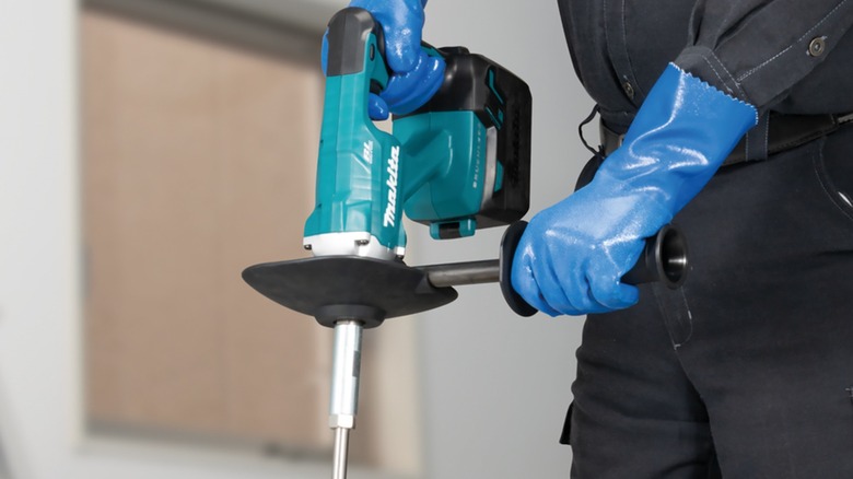 mixing a solution with Makita mixer drill