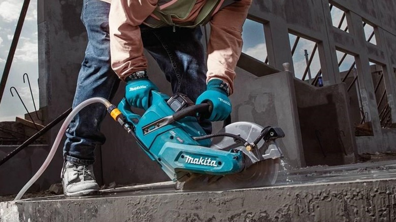 cutting concrete with Makita power cutter