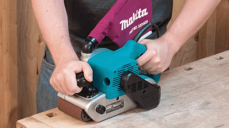 sanding benchtop with Makita belt sander