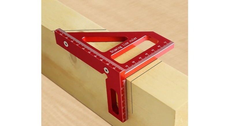 Red 3D angle measuring ruler set on a wood