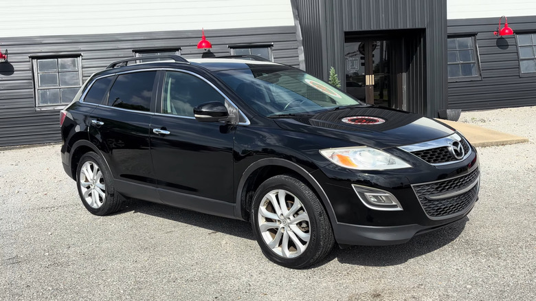 A black 2011 Mazda CX-9 parked