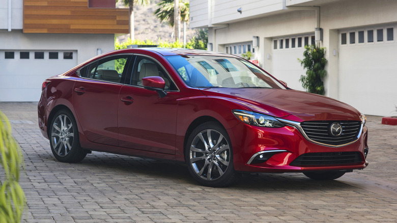 A red 2017 Mazda6 parked