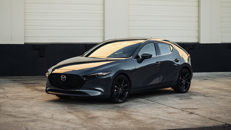 A gray 2022 Mazda3 hatchback parked