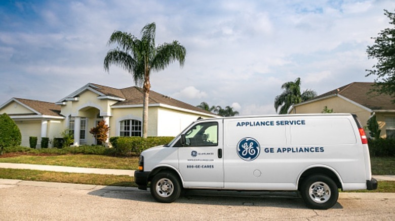 A General Electric van parked outside a home