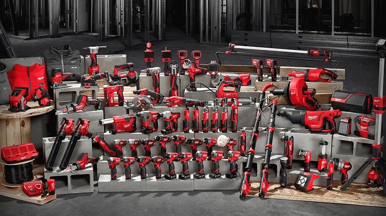 Several Milwaukee M12 tools displayed on shelves.