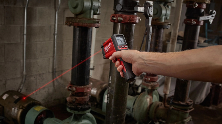 Person using Milwaukee infrared temp-gun