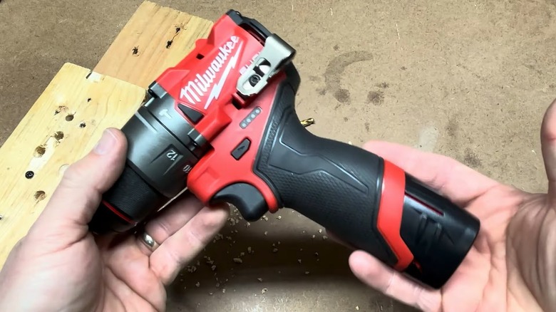 Person holding Milwaukee 1/2-inch drill