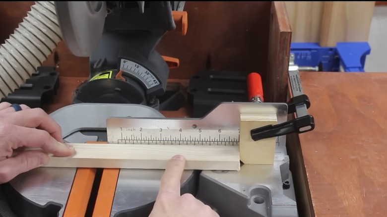 a homemade stop block on a miter saw
