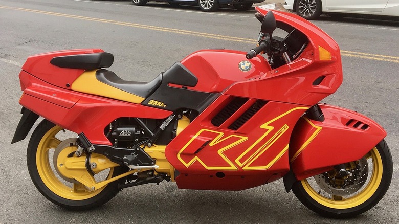 REd 1991 BMW K1 Sportbike parked on shoulder of the road