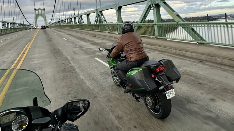 SlashGear writer Travis Langness crossing an Oregon bride on a Kawasaki H2 SX SE
