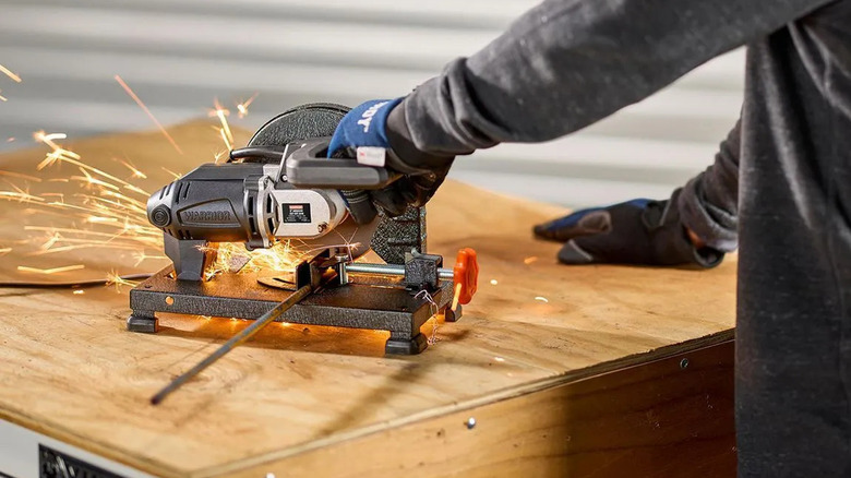 Warrior cut-off saw with sparks flying