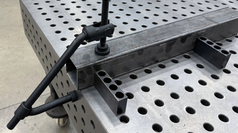 Fireball Tool's double gooseneck clamp being used on a fixture table