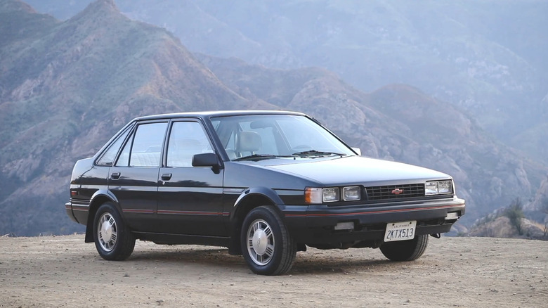 A black 1988 Chevrolet Nova parked