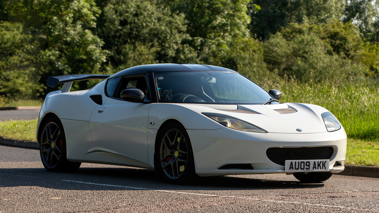 A white 2008 Lotus Evora parked