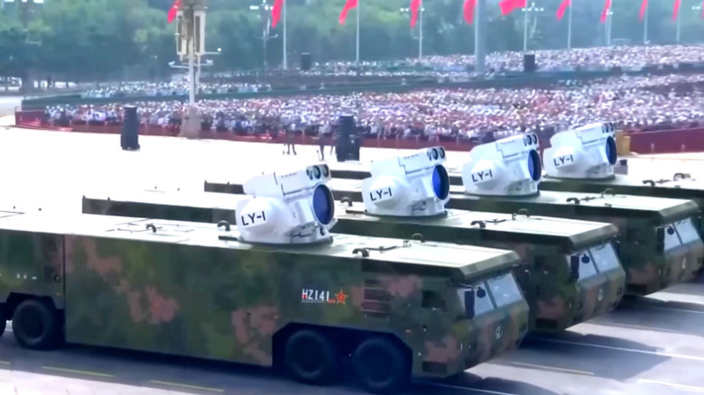 Four chinese LY-1 ground-based laser weapon systems moving in formation.