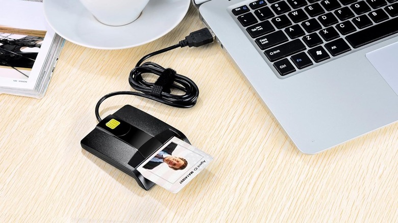 A USB ID card reader plugged into a laptop