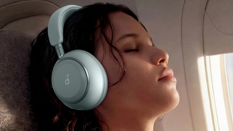 A person wearing the Anker Soundcore Space 2 headphones on a flight