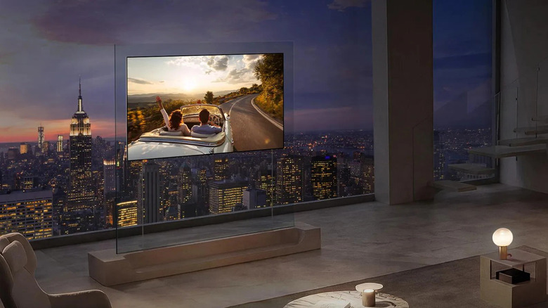 LG OLED evo W6 TV in front of a window showing the cityscape