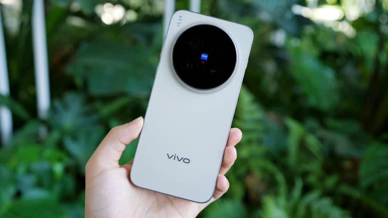 A person holding the Vivo X300 Pro phone.