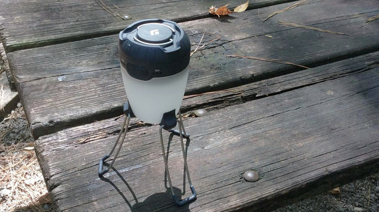 The Black Diamond Apollo standing on a table.