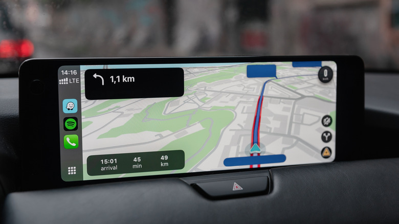 Waze navigation interface on a car's infotainment display via Apple CarPlay