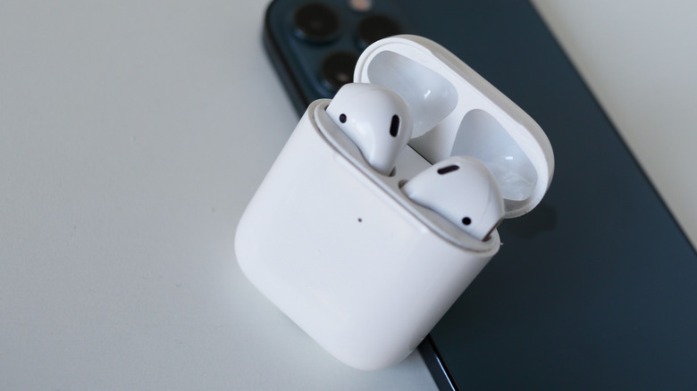 Apple AirPods Pro (2nd Gen) next to an iPhone.