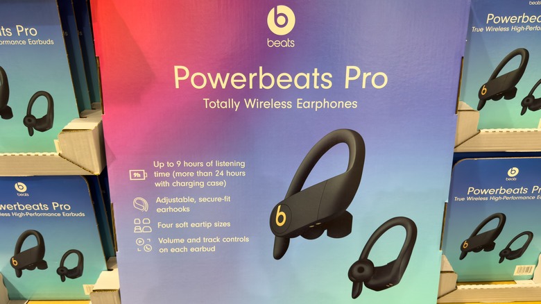 Boxed Powerbeats Pro earbuds on display.