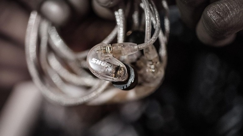 A closeup of a Shure SE215 Pro earbud.