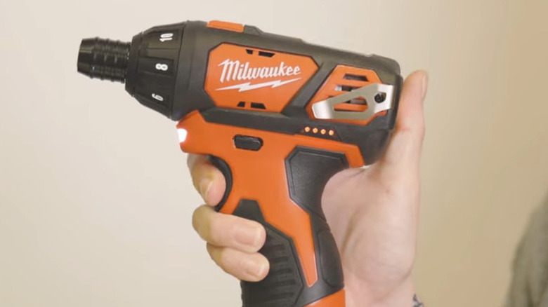 person holding Milwaukee hex screwdriver