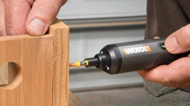 attaching wood pieces with electric screwdriver and screw