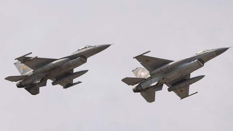 Two romanian air force F-16 fighting falcons performing at an air show