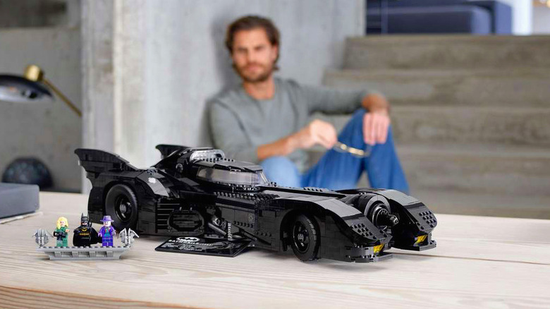 A man in the background admires his build of the 1989 Batmobile.
