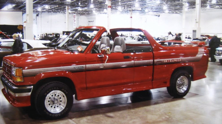 A red 1991 Ford Skyranger in a showroom