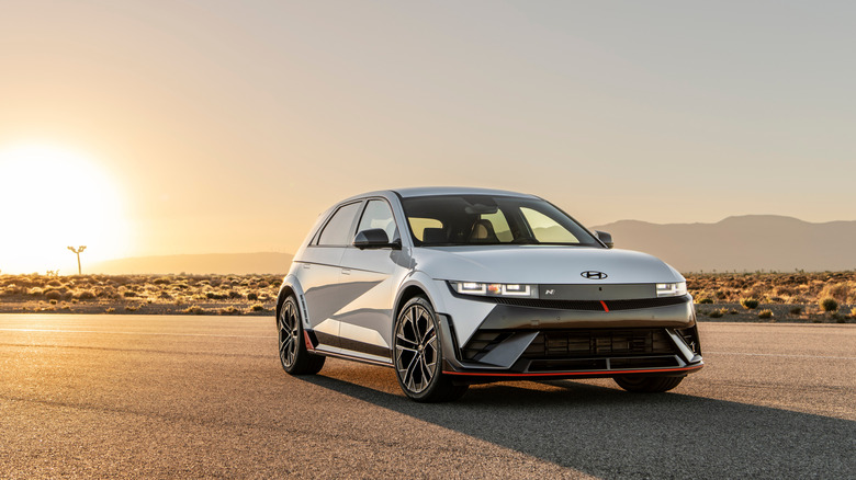 Hyundai Ioniq 5 N front 3/4 view with the sun in the background
