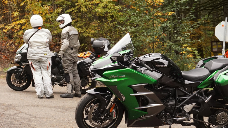 Two riders, one wearing Klim gear, the other wearing Aerostitch