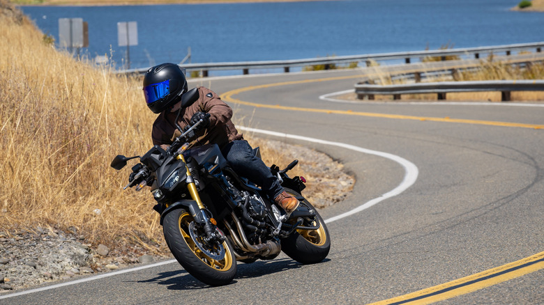Rider on the Honda CB1000 Hornet SP wearing an Arai Helmet, REV'IT! jacket and gloves, Dainese pants, and Alpinestars shoes
