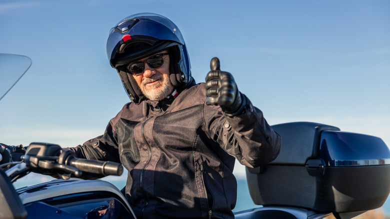 Thumbs up from bike rider