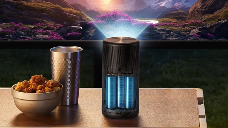 The Anker Nebula Capsule 3 Laser projecting a landscape at night.