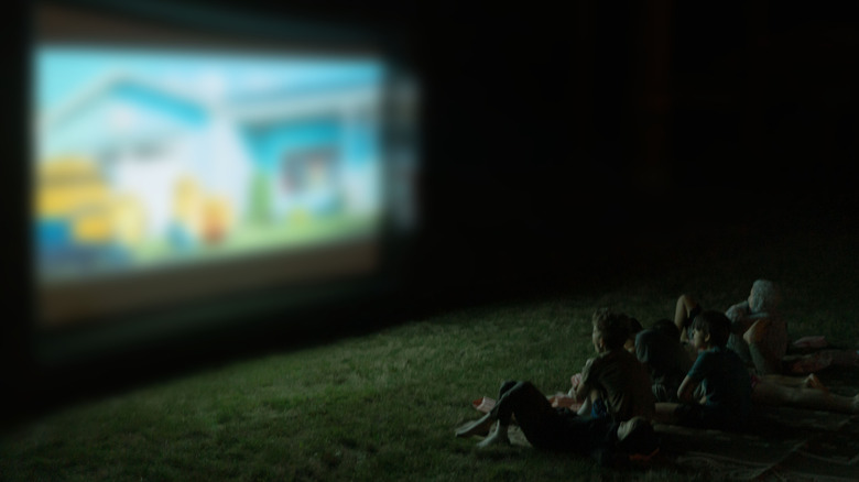 watching a movie on the grass under the stars.
