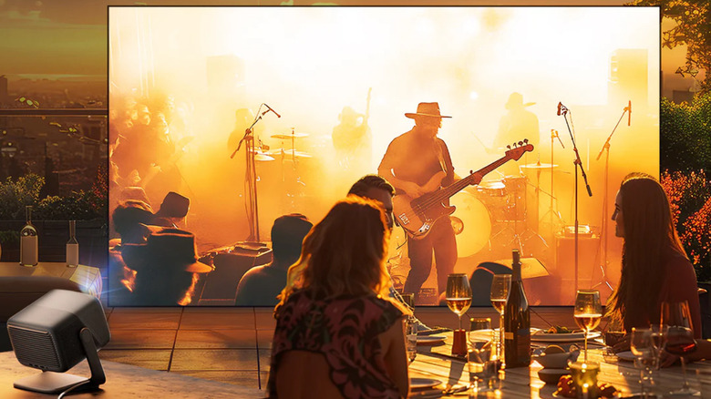 Watching a rock concert on a screen projection from the JMGO N1S Pro 4K.