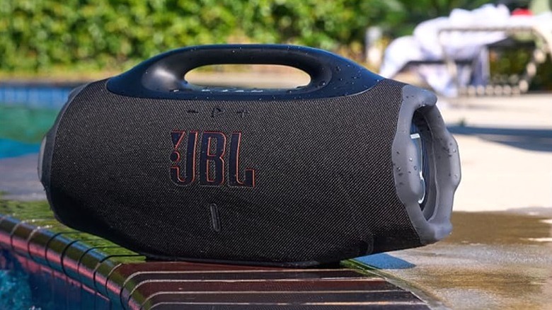 JBL Boombox 4 placed alongside a pool.