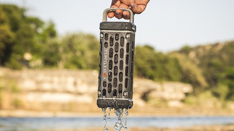 Taking a Turtlebox Ranger out of water with a carrying handle.