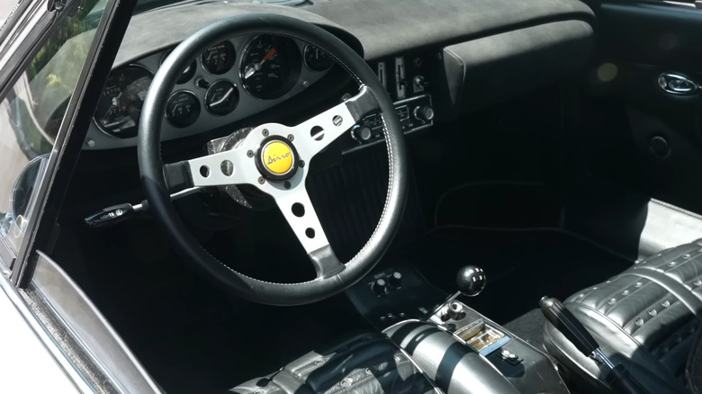 Ferrari Dino 246 GT interior photographed from an open driver-side window