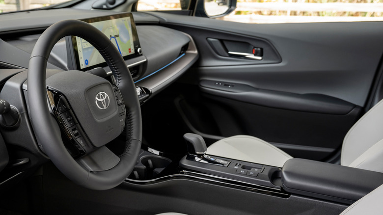 2025 Toyota Prius transmission tunnel, steering wheel and infotainment system